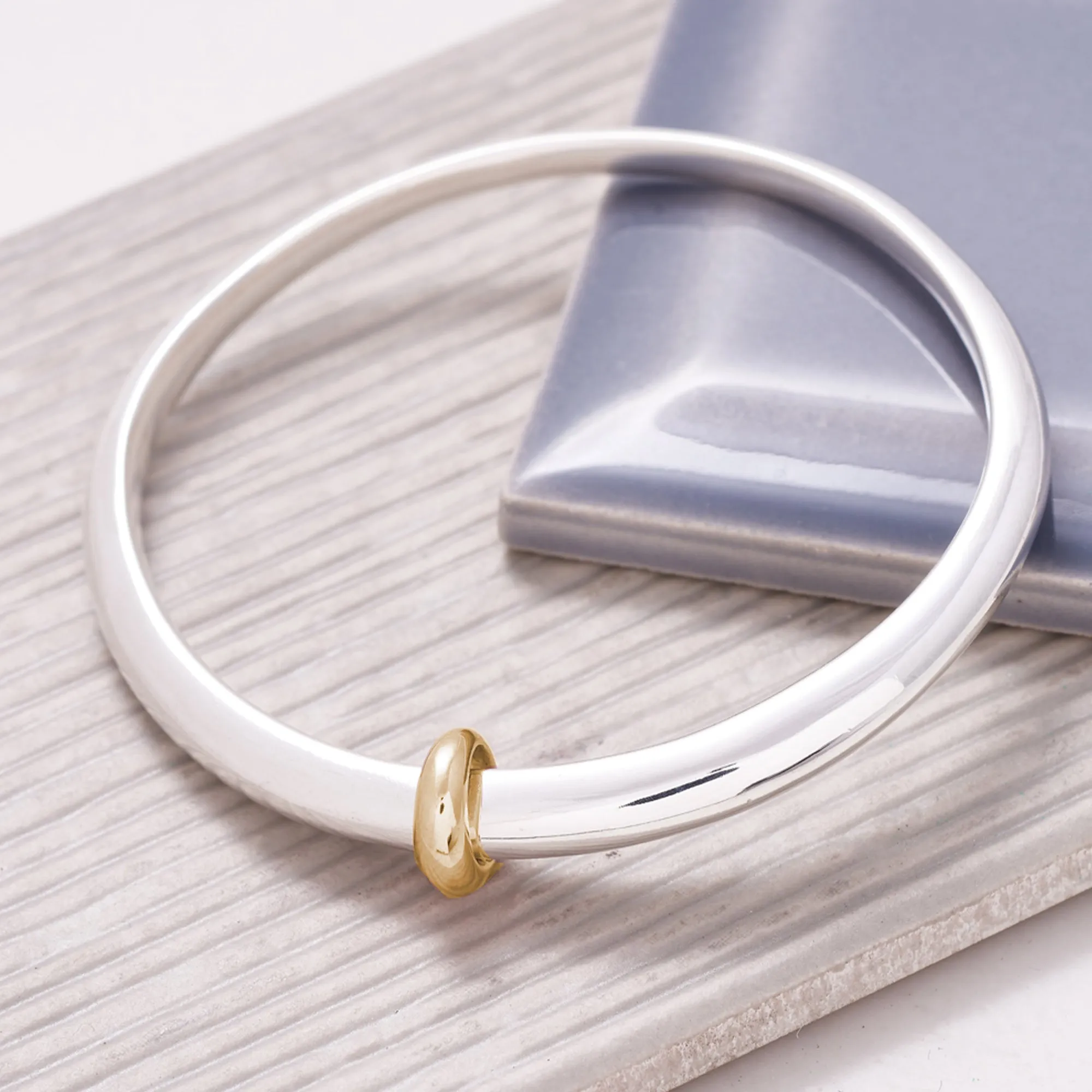 Eclipse Silver Oval Bangle With Gold Loop